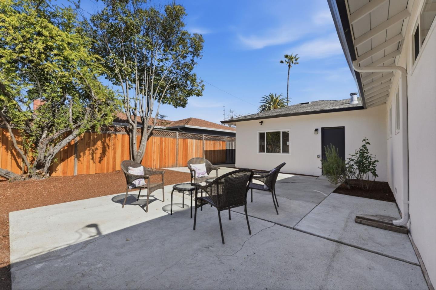 774 Ridge Rd. Santa Clara, CA 95051 - Photo 39 of 50 a view of a patio with table and chairs and potted plants