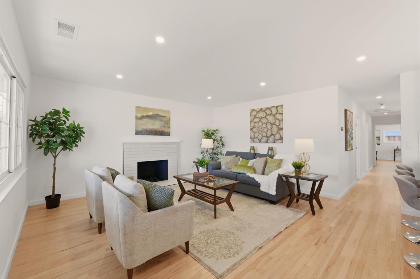 774 Ridge Rd. Santa Clara, CA 95051 - Photo 4 of 50 a living room with furniture a potted plant and a fireplace