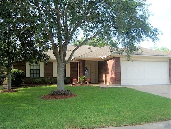 509 Teal Drive Dickinson, TX 77539 - Photo 1 of 23 a front view of a house with a yard and garage
