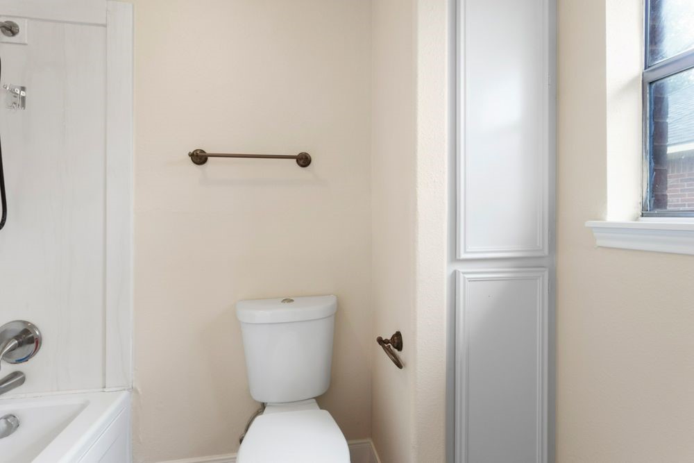 509 Teal Drive Dickinson, TX 77539 - Photo 12 of 23 a white toilet sitting next to a bath tub