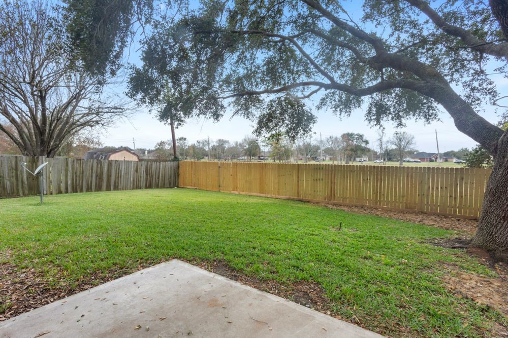 509 Teal Drive Dickinson, TX 77539 - Photo 18 of 23 a view of a yard with an outdoor space