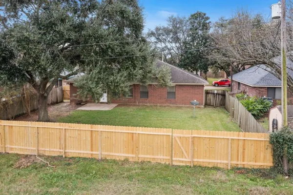 an aerial view of house with yard
