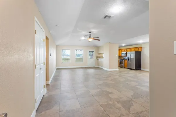 a view of an empty room with a window
