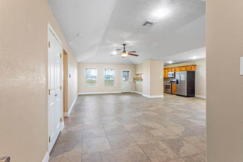 509 Teal Drive Dickinson, TX 77539 - Photo 3 of 23 a view of an empty room with a window
