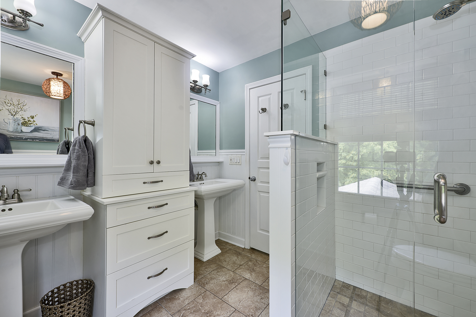 1550 Banbury Road Inverness, IL 60067 - Photo 11 of 32 a bathroom with a double vanity sink mirror and shower