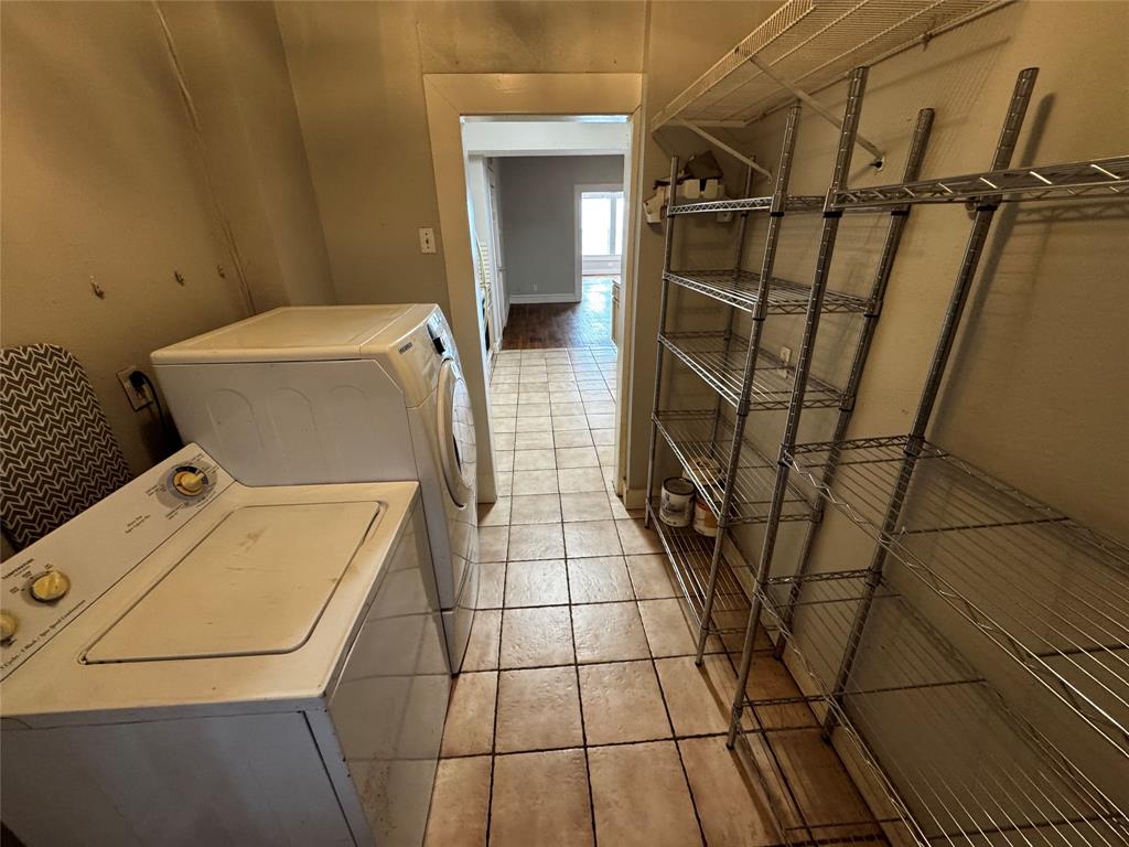 5321 Reiger Avenue, Unit 1 Dallas, TX 75214 - Photo 11 of 18 a bathroom with a granite countertop sink and a mirror