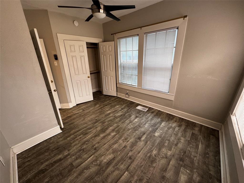 5321 Reiger Avenue, Unit 1 Dallas, TX 75214 - Photo 14 of 18 wooden floor in an empty room with a window