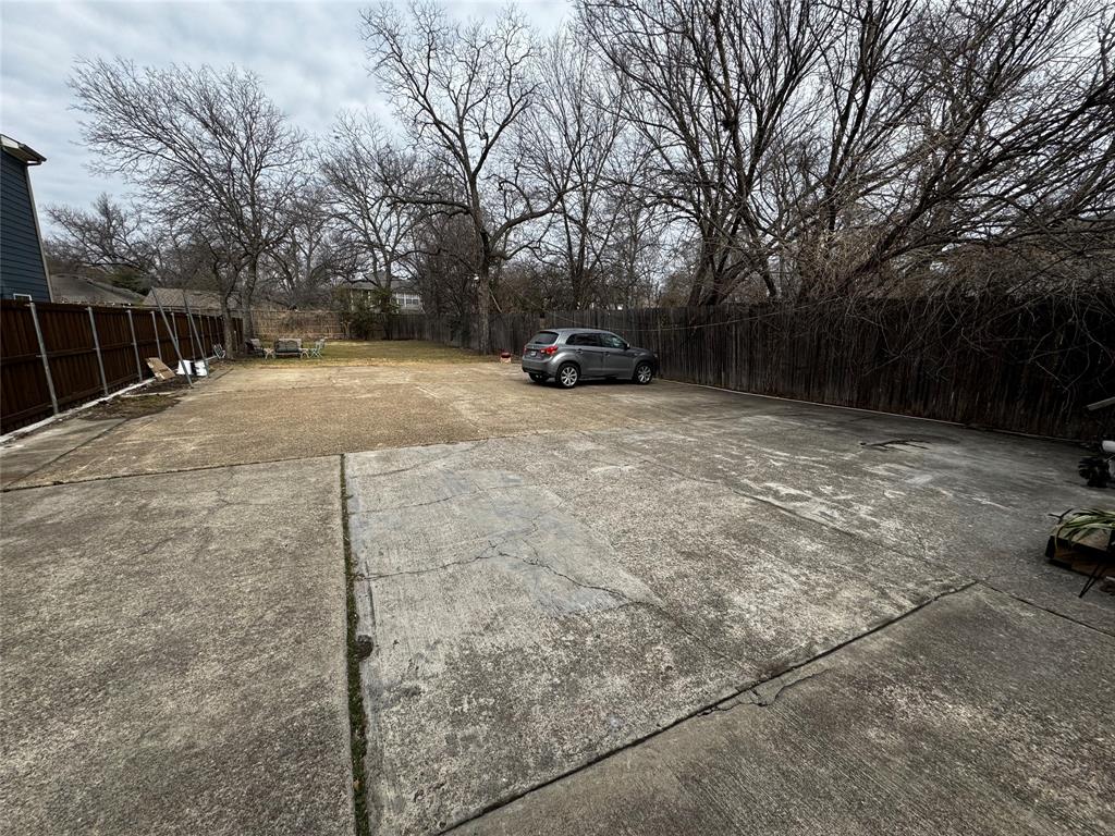 5321 Reiger Avenue, Unit 1 Dallas, TX 75214 - Photo 17 of 18 a car parked on the side of road