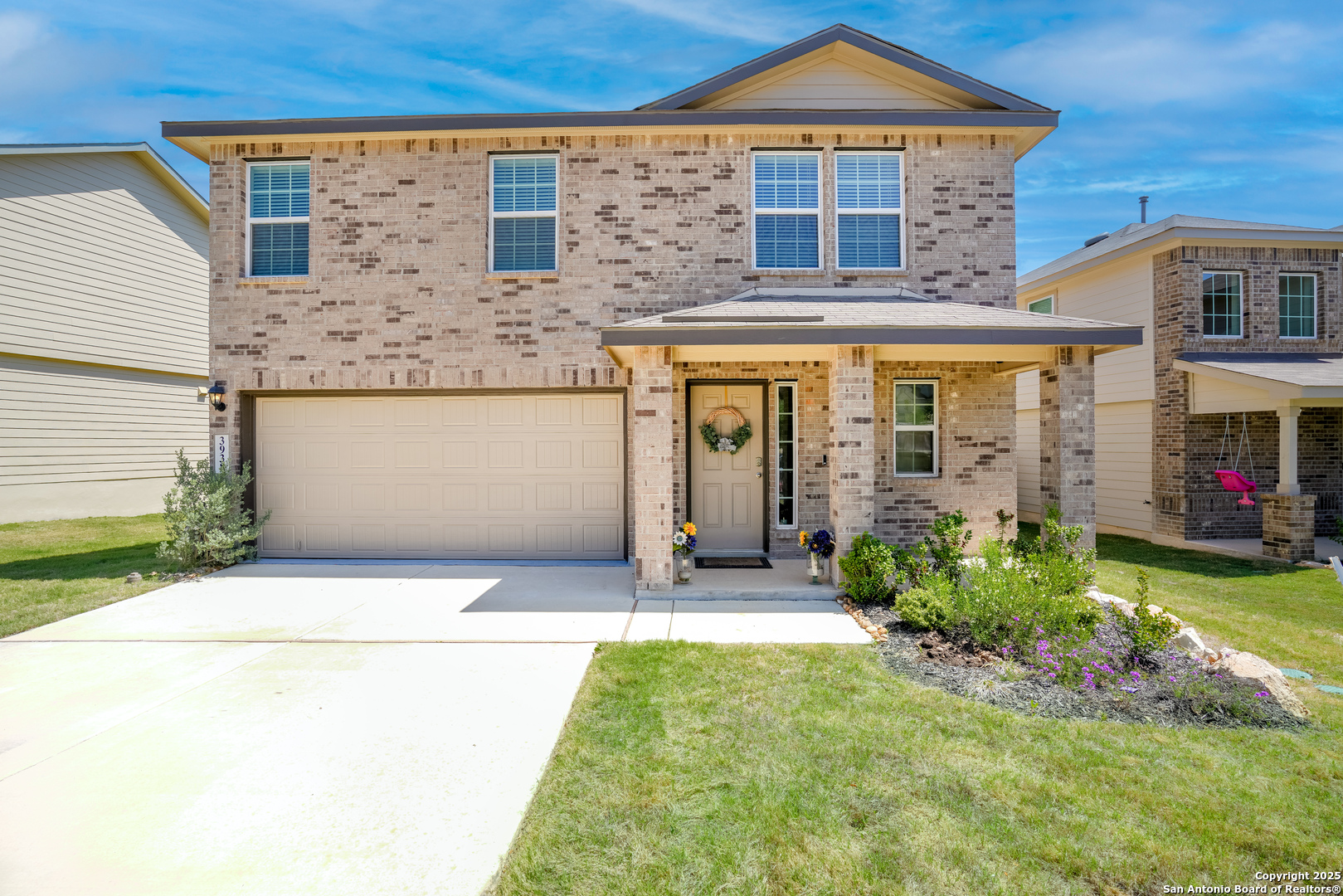 a front view of a house with garden