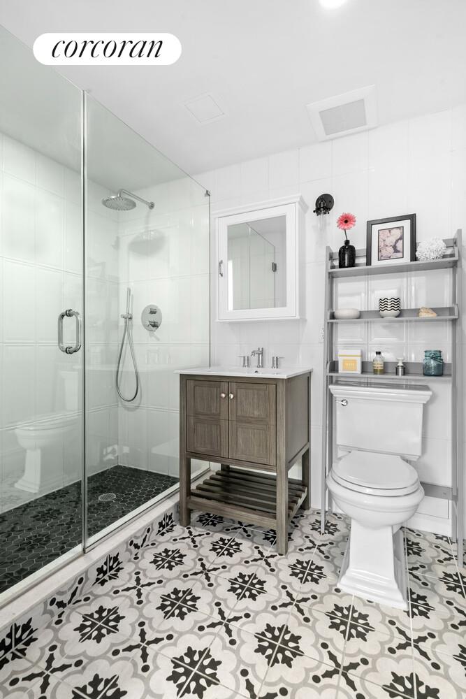 1255 Bushwick Avenue, Unit 5C Brooklyn, NY 11207 - Photo 4 of 8 a bathroom with a toilet sink and shower