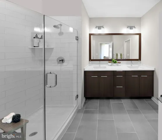 a spacious bathroom with a tub sink and mirror