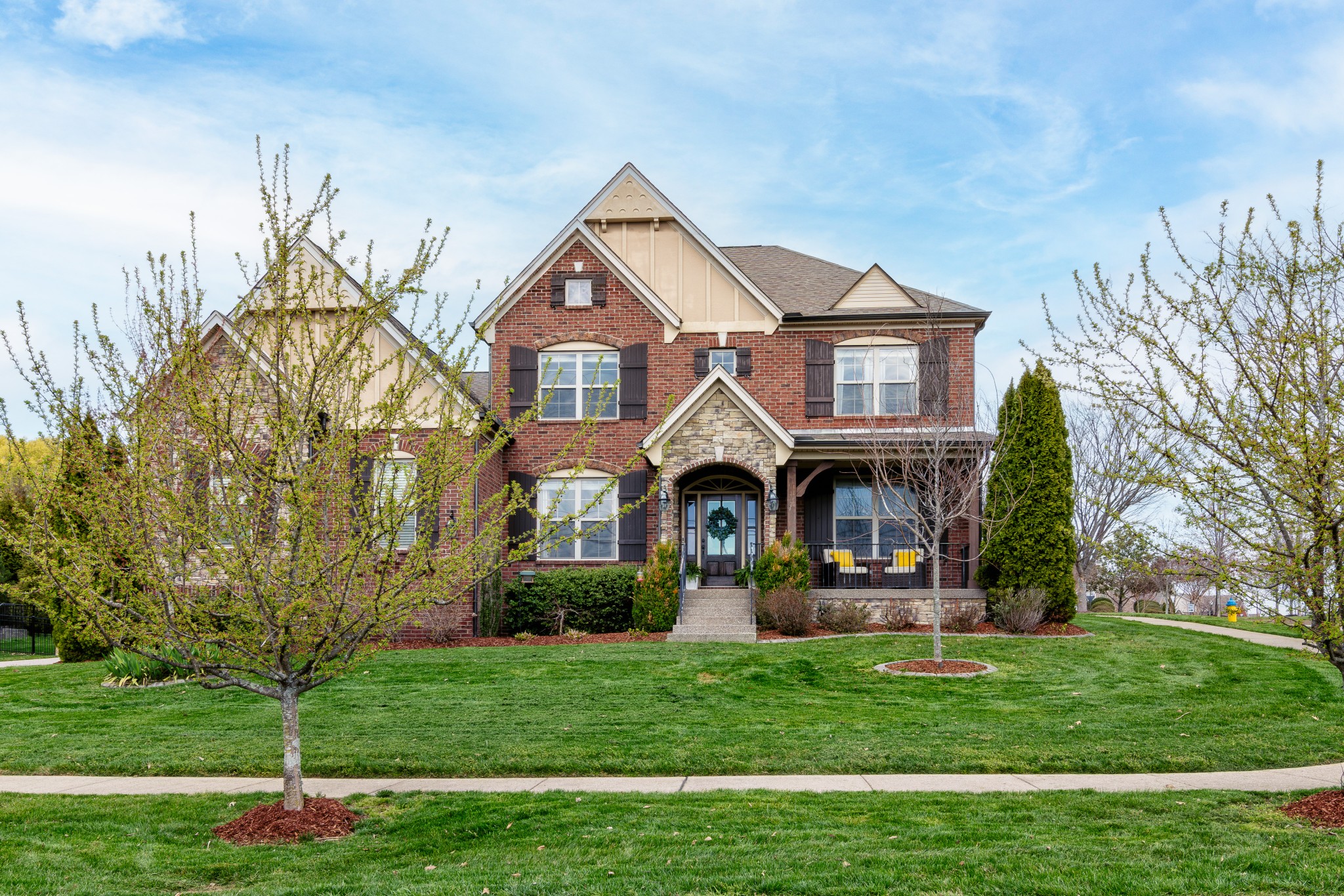 a front view of a house with a yard