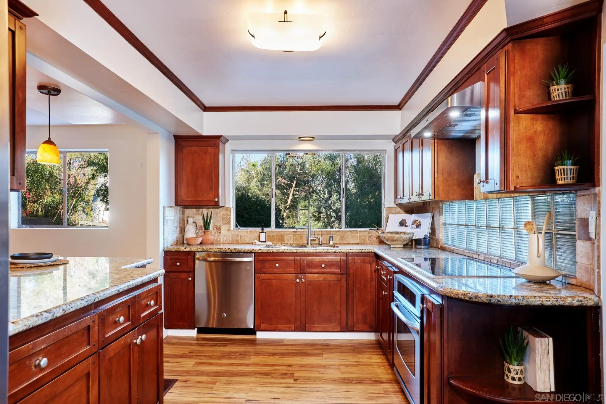 9080 Terrace Drive La Mesa, CA 91941 - Photo 11 of 25 a kitchen with a stove and a sink
