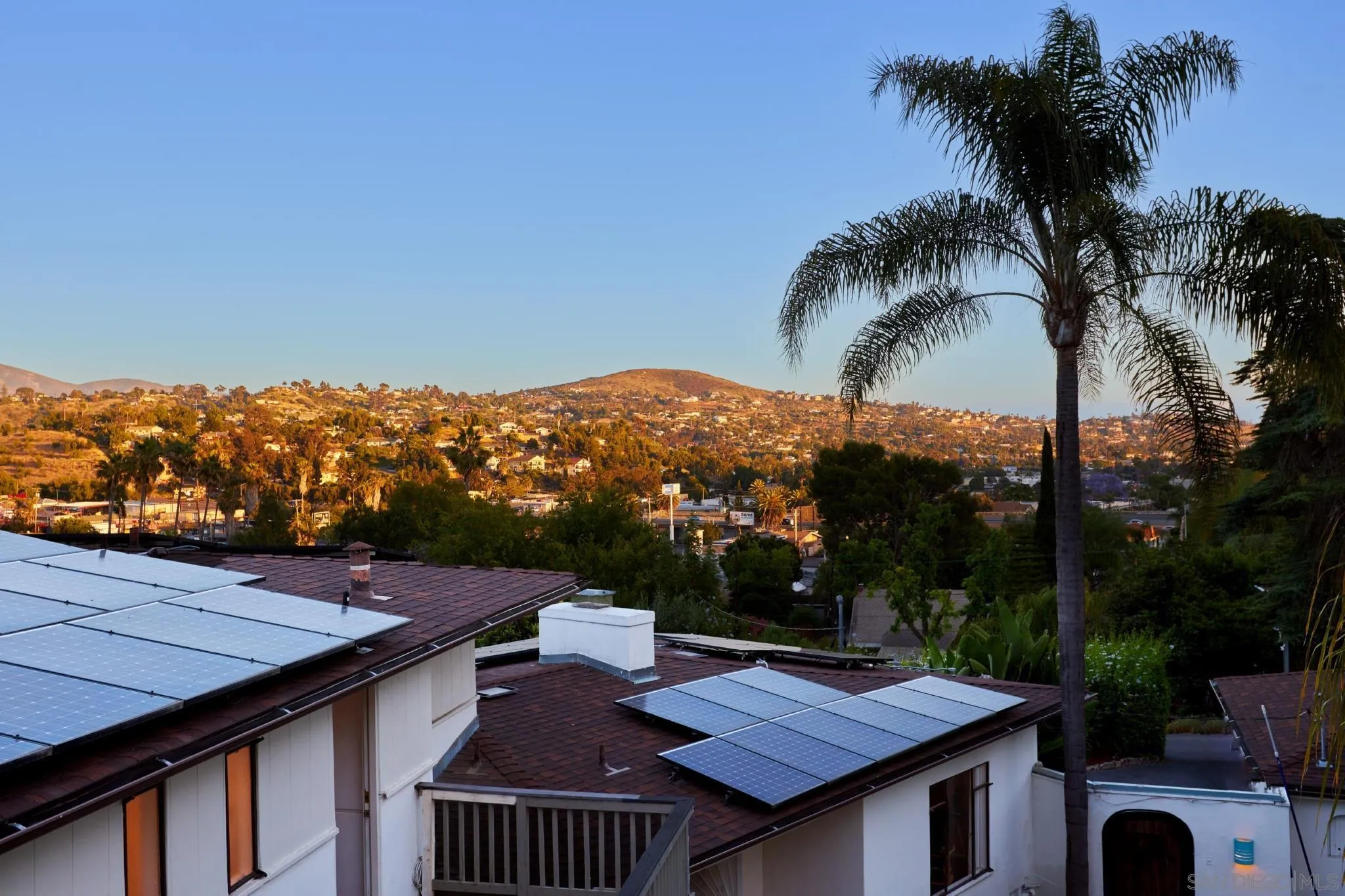 9080 Terrace Drive La Mesa, CA 91941 - Photo 19 of 25 a view of a terrace with a table and chairs under an umbrella