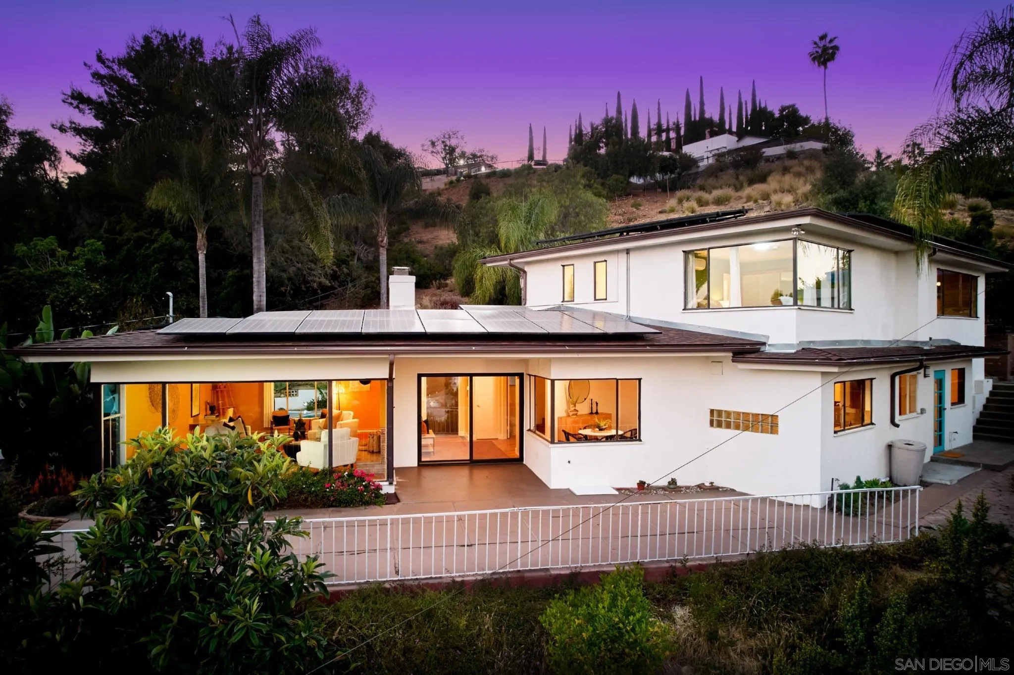 9080 Terrace Drive La Mesa, CA 91941 - Photo 2 of 25 a view of a house with a swimming pool next to a yard