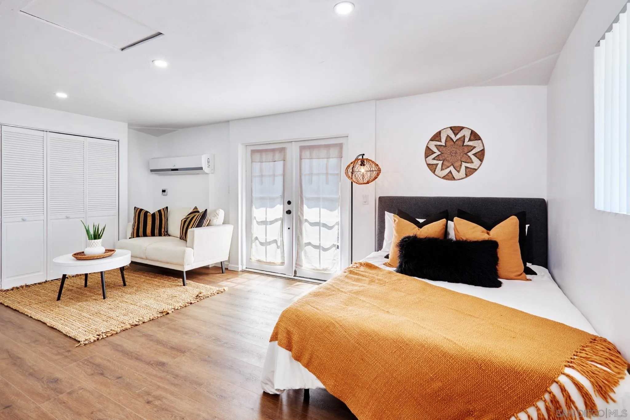 9080 Terrace Drive La Mesa, CA 91941 - Photo 22 of 25 a bedroom with a large bed and a table