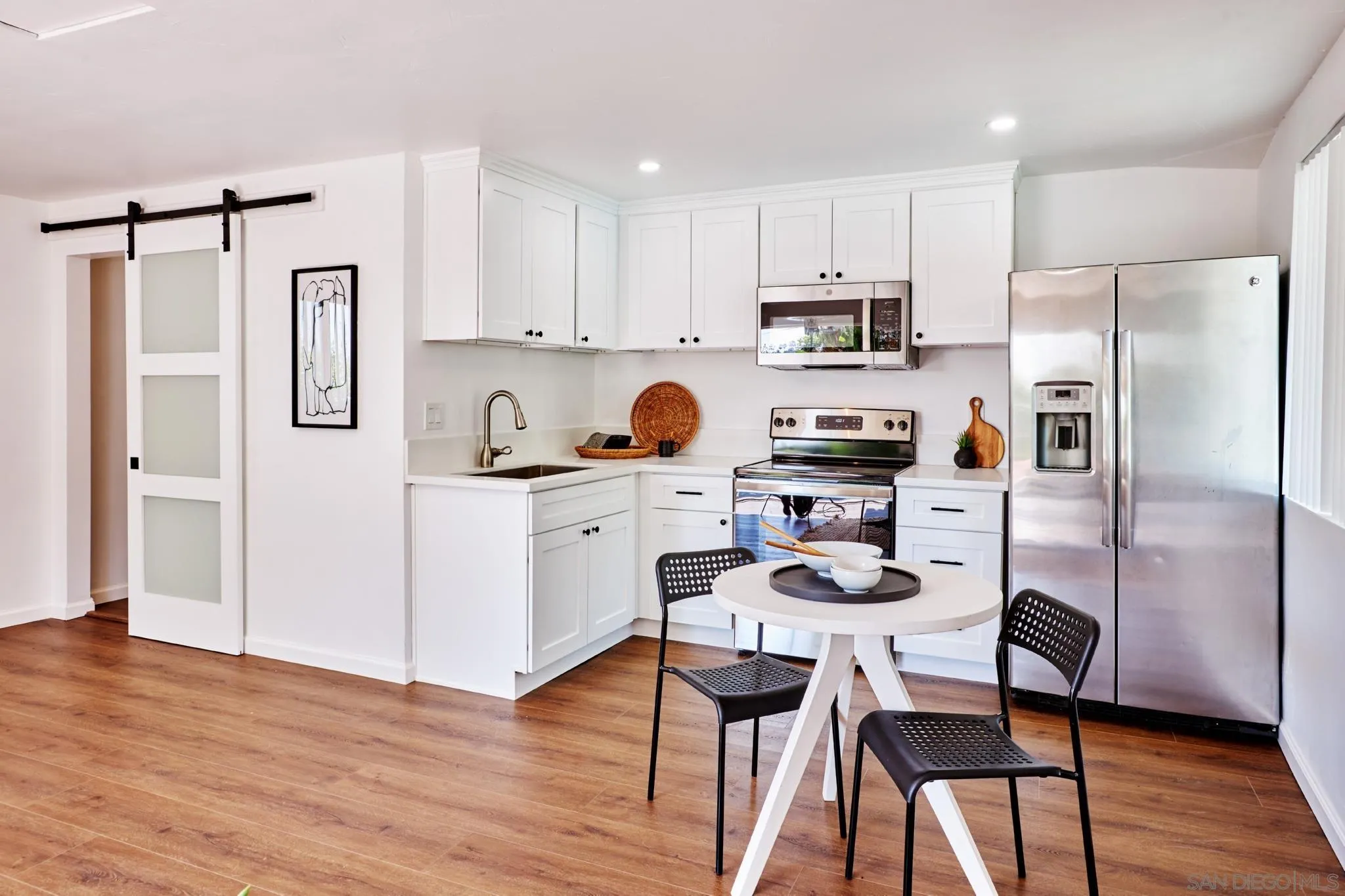 9080 Terrace Drive La Mesa, CA 91941 - Photo 24 of 25 a kitchen with stainless steel appliances a refrigerator stove microwave and cabinets