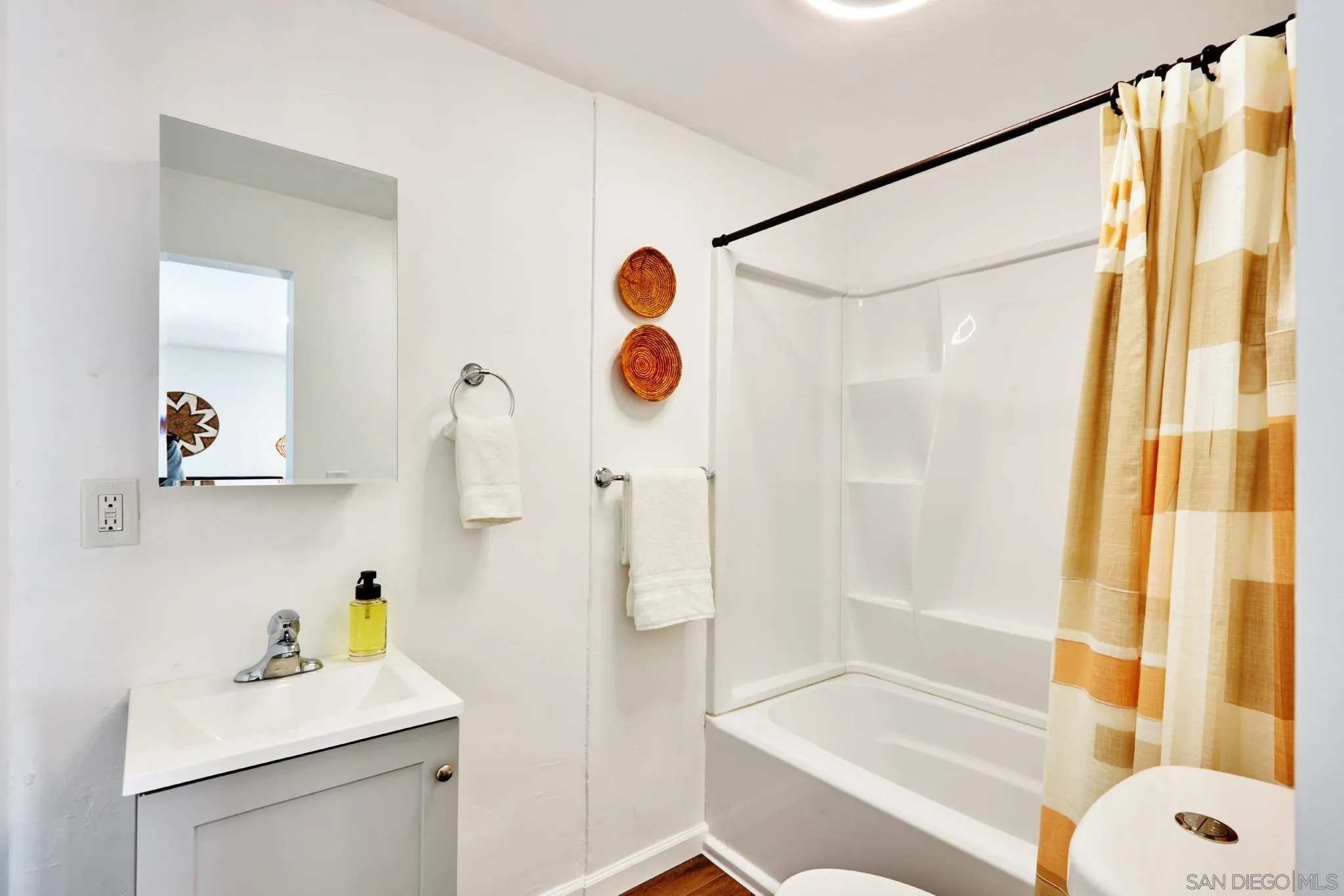 9080 Terrace Drive La Mesa, CA 91941 - Photo 25 of 25 a bathroom with a sink mirror and shower