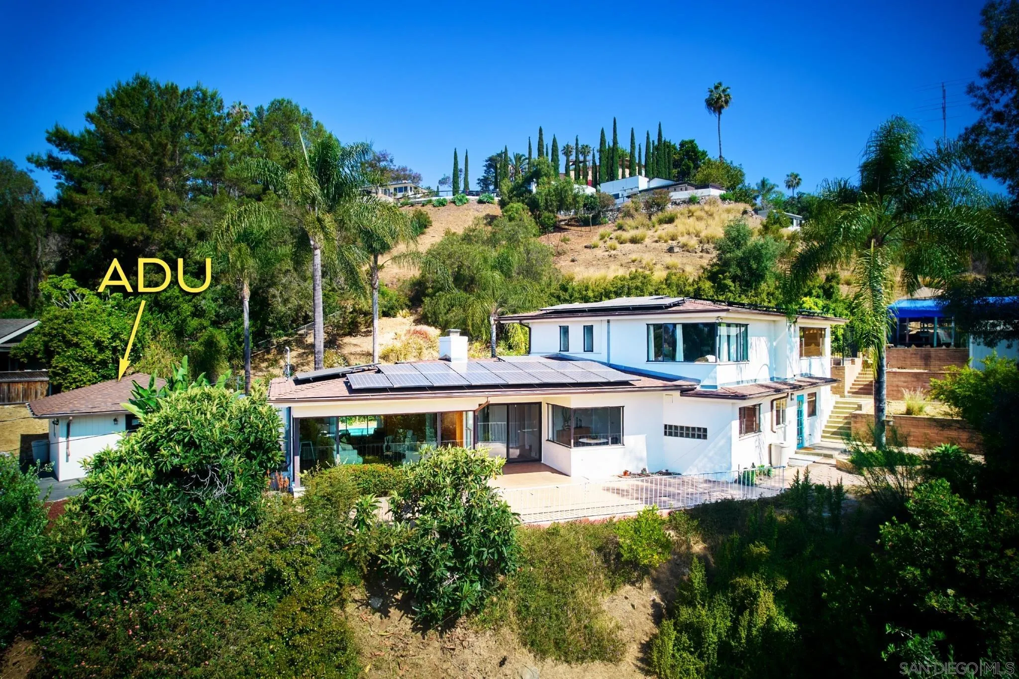 9080 Terrace Drive La Mesa, CA 91941 - Photo 4 of 25 a front view of a house with a yard