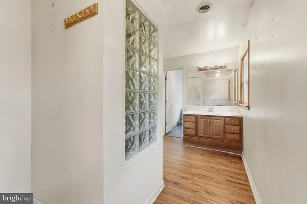 a bathroom with shower and mirror