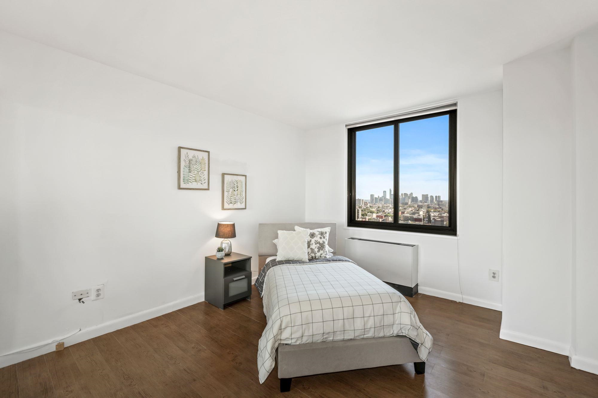380 Mountain Road, Unit 704 Union City, NJ 07087 - Photo 12 of 21 a bedroom with a bed and window