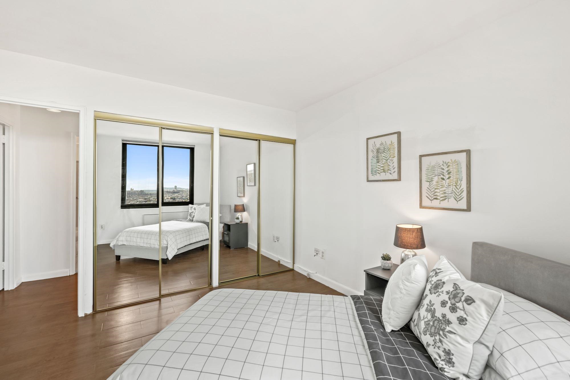 380 Mountain Road, Unit 704 Union City, NJ 07087 - Photo 14 of 21 a bedroom with a bed and a window