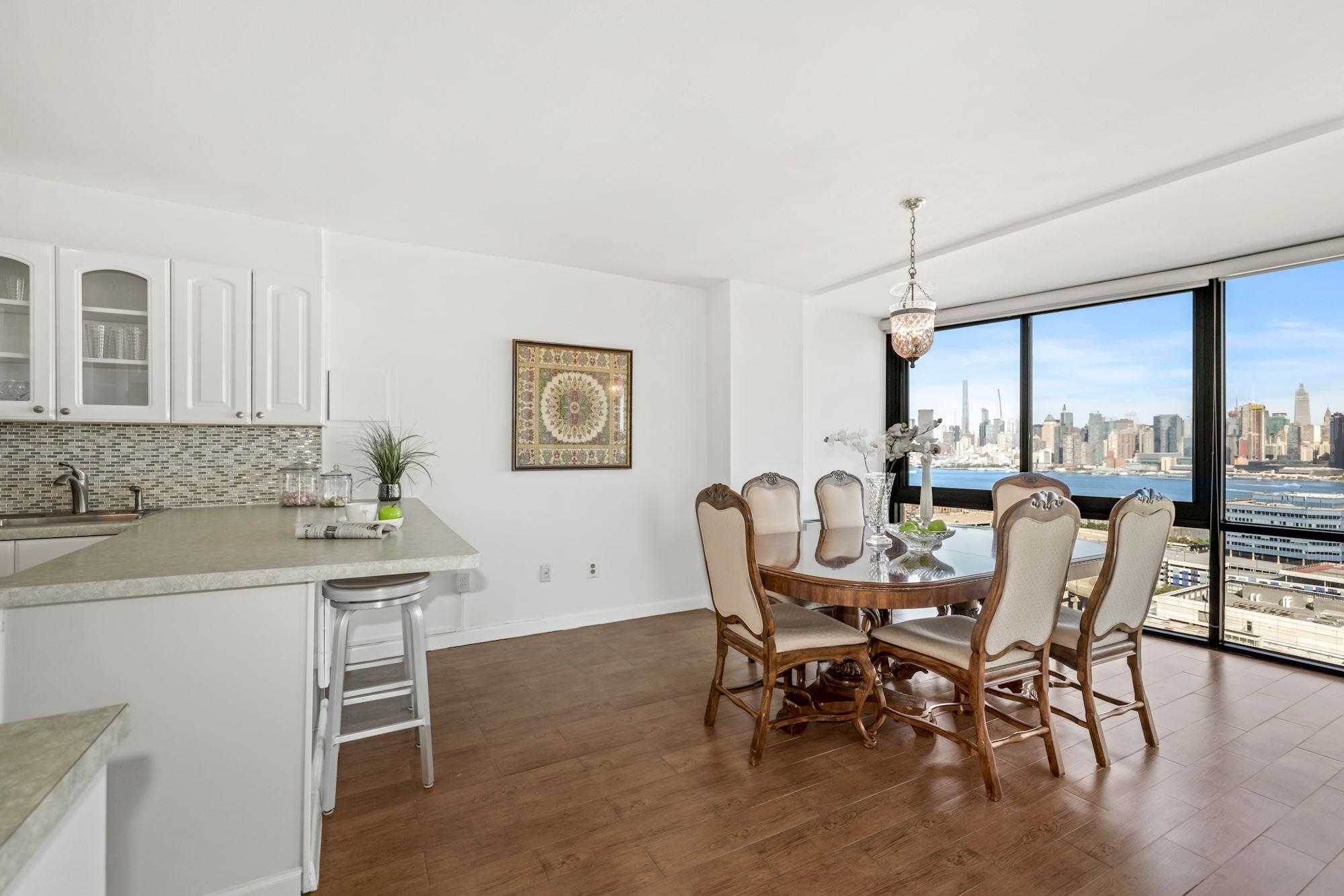 380 Mountain Road, Unit 704 Union City, NJ 07087 - Photo 2 of 21 a view of a dining room with furniture and a window