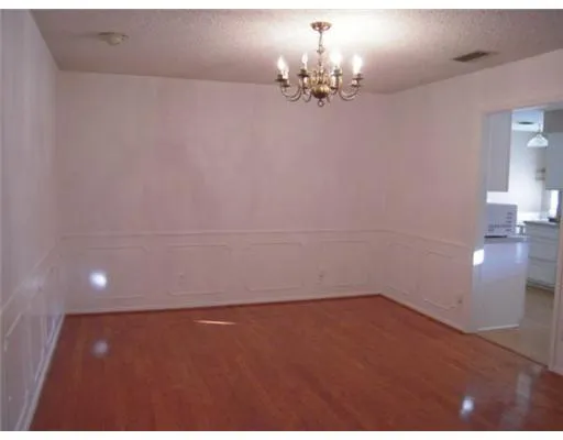 a kitchen with a sink and a refrigerator