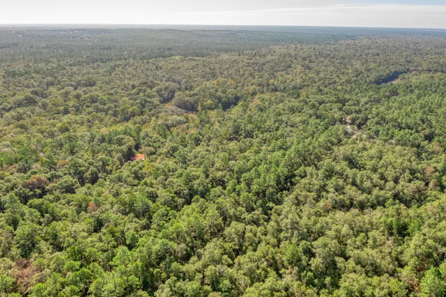 a view of a field with an outdoor space