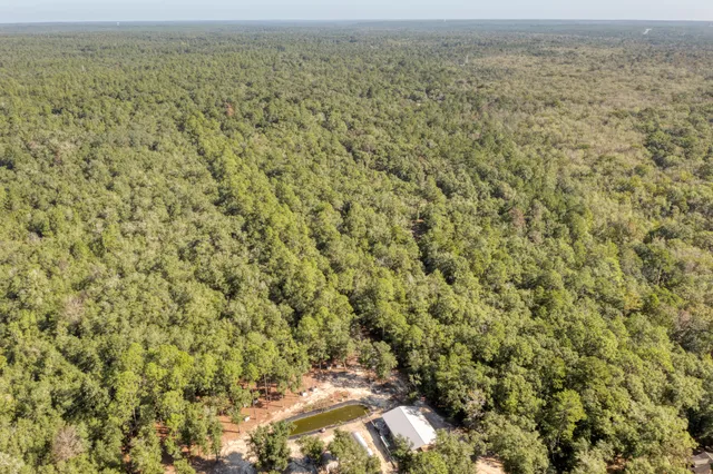 a view of a field with an outdoor space