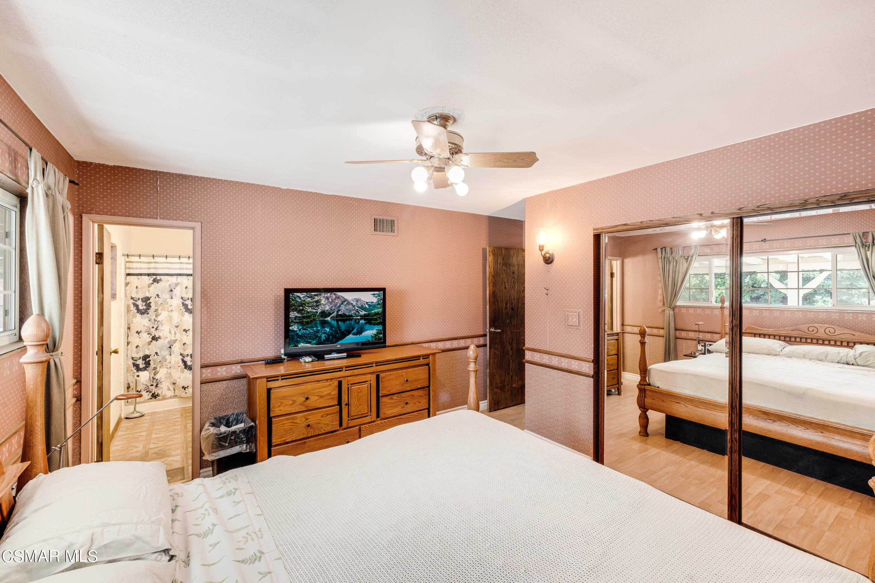 3379 Weatherford Court Simi Valley, CA 93063 - Photo 16 of 39 a bedroom with a bed and a chandelier