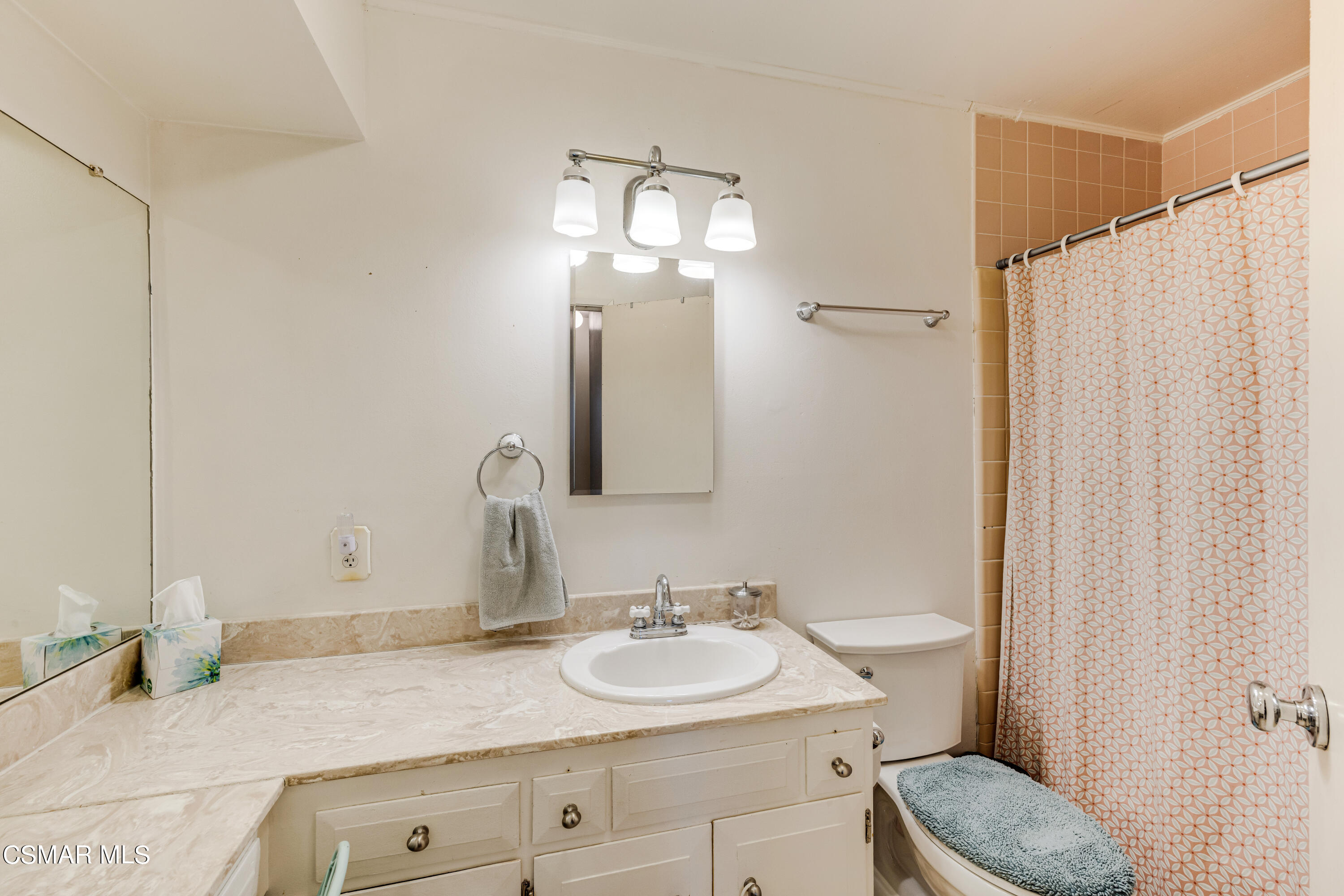 3379 Weatherford Court Simi Valley, CA 93063 - Photo 18 of 39 a bathroom with a granite countertop sink and a mirror