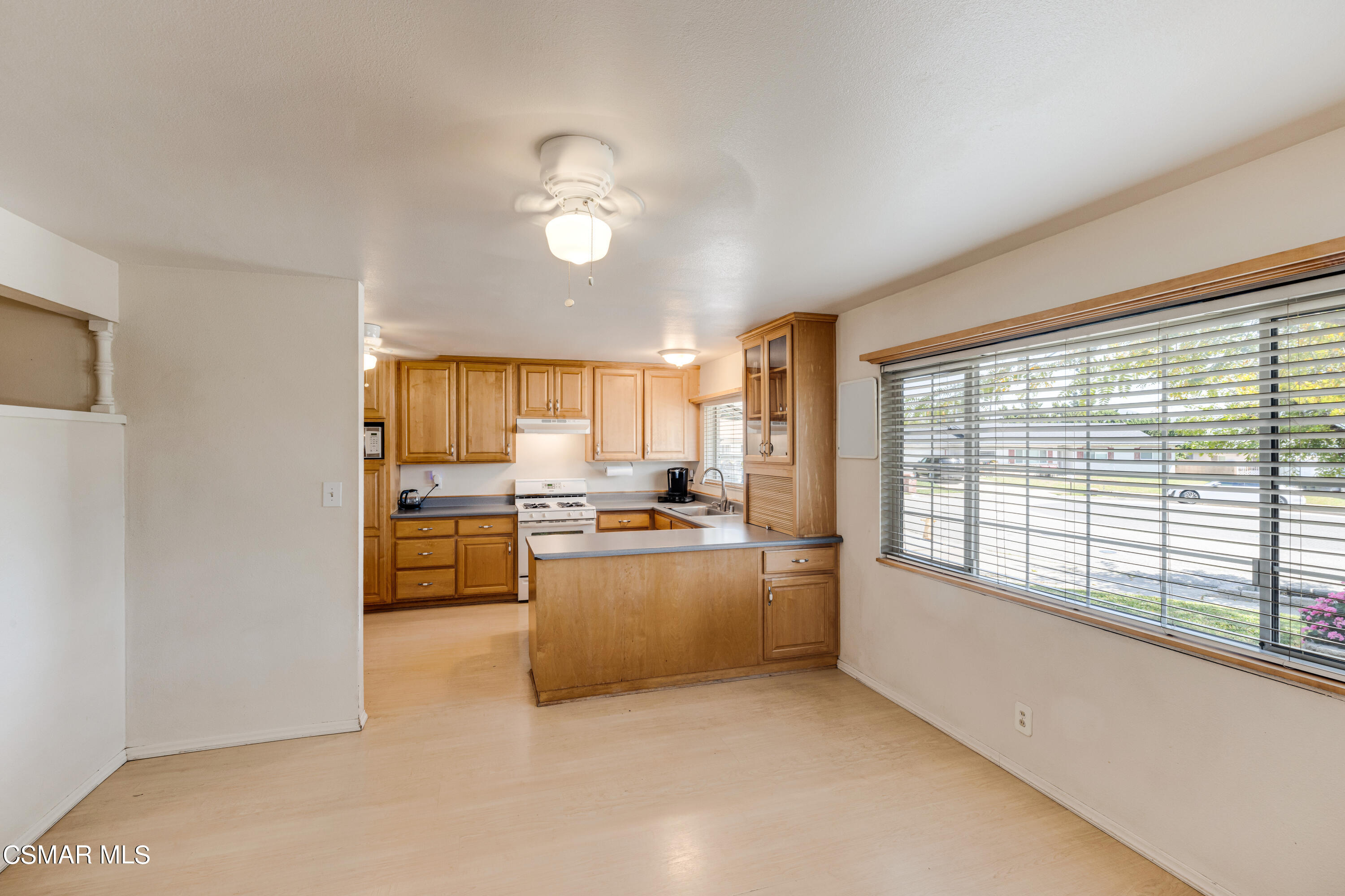 3379 Weatherford Court Simi Valley, CA 93063 - Photo 20 of 39 a kitchen with stainless steel appliances granite countertop a stove and a large window