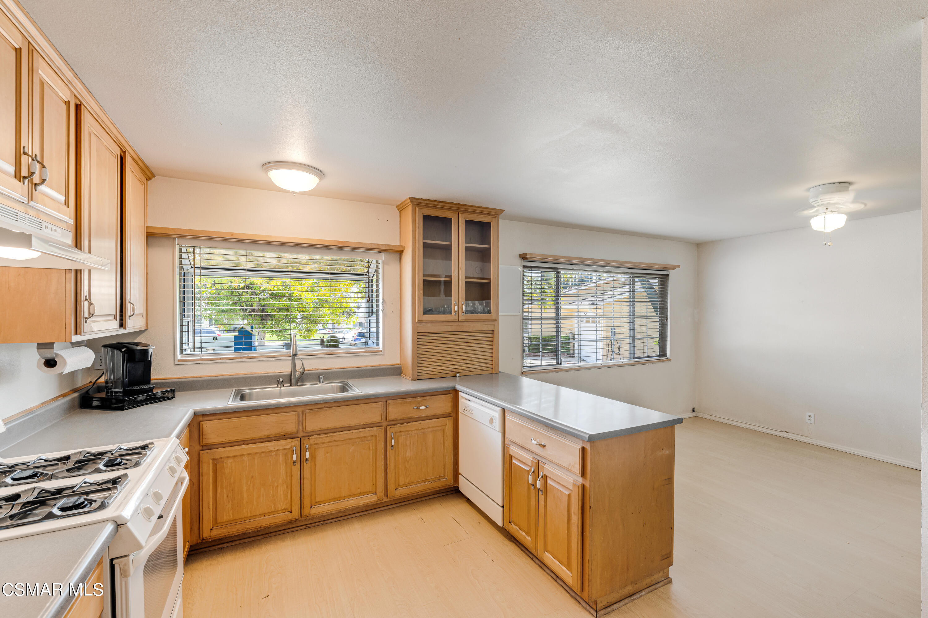 3379 Weatherford Court Simi Valley, CA 93063 - Photo 24 of 39 a kitchen that has a sink and a stove in it