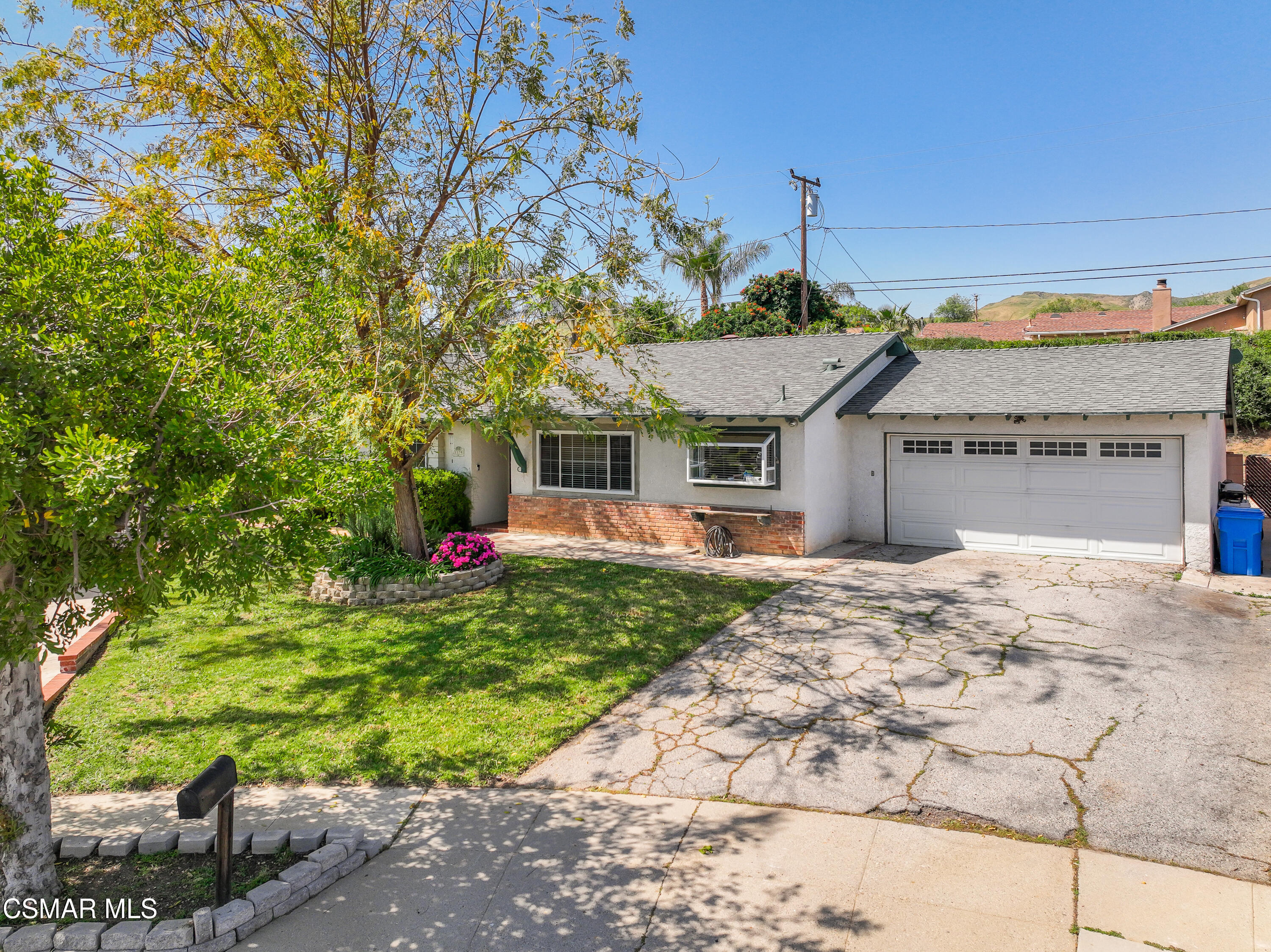 3379 Weatherford Court Simi Valley, CA 93063 - Photo 36 of 39 a front view of a house with a yard and a garage