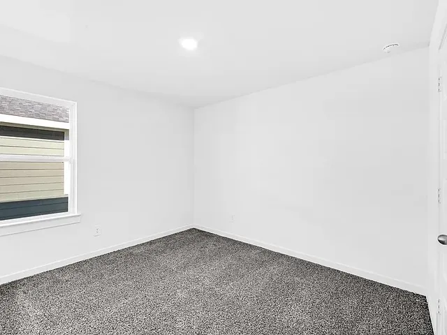 a view of a room that has a window in it