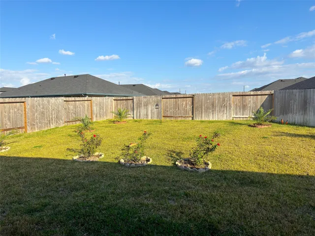 a view of a swimming pool with an outdoor space and seating area