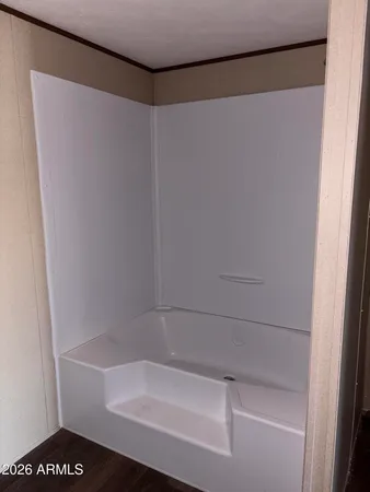 an empty room with a empty space and windows