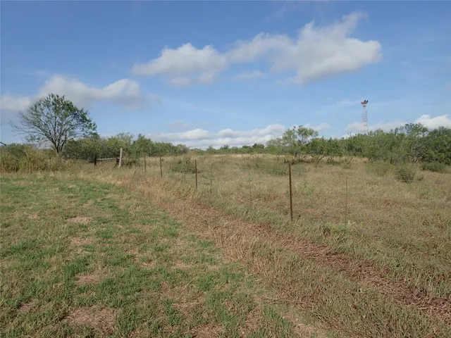 a view of a lake with houses in the back