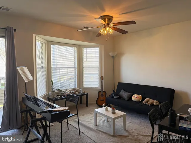 a room with a bed and a window