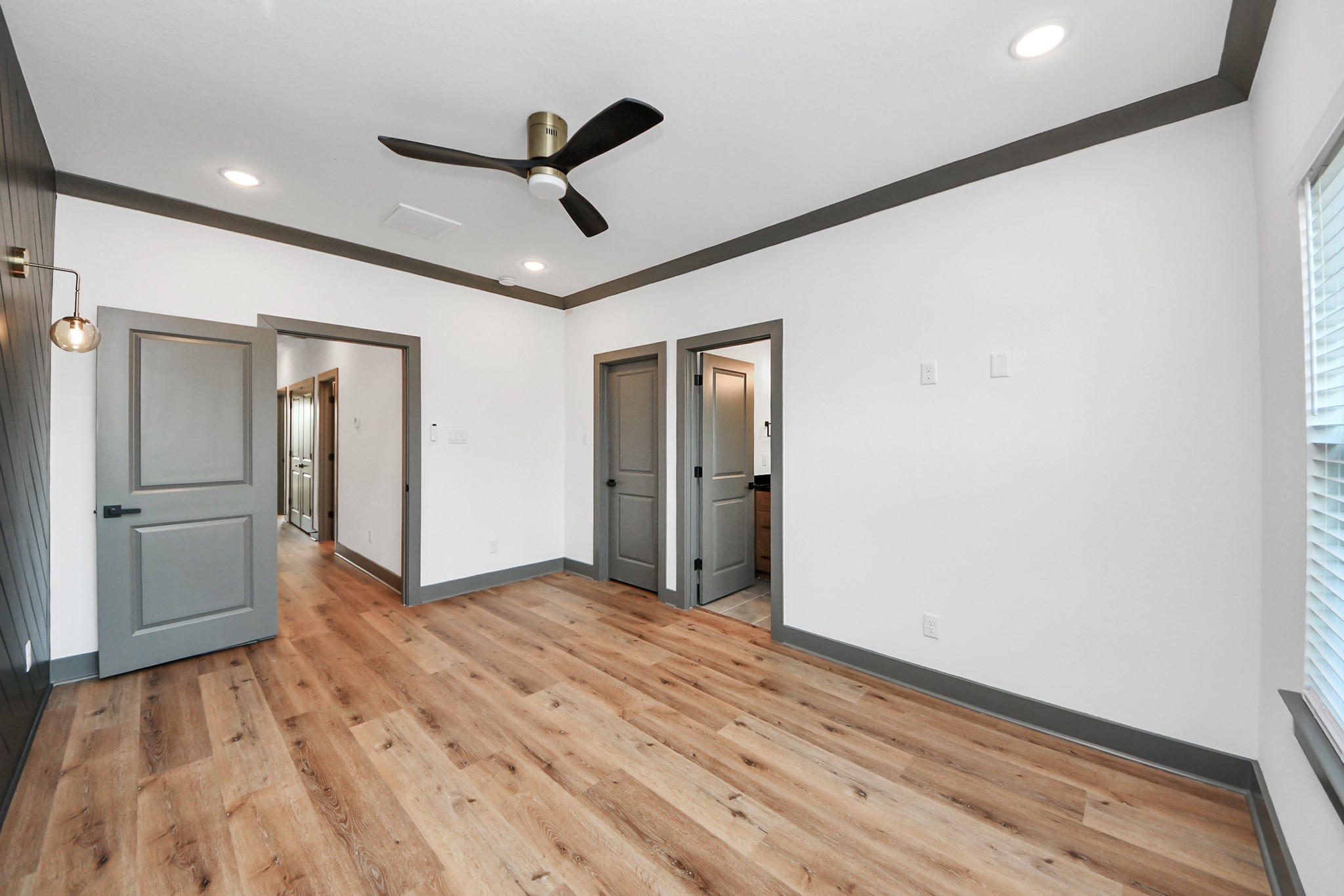 7925 Ritz Street Houston, TX 77028 - Photo 22 of 35 a view of empty room with wooden floor and ceiling fan