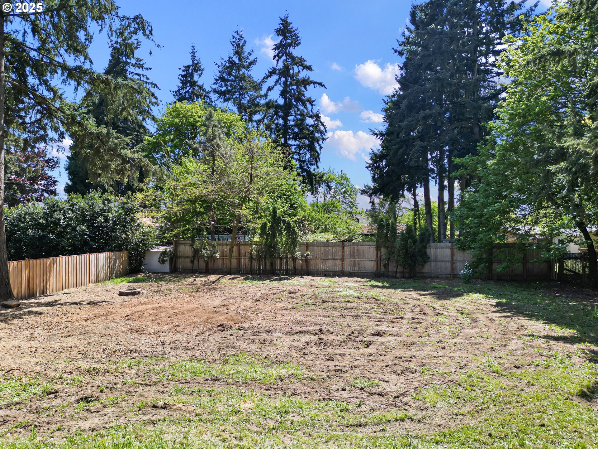 Undisclosed Address Eugene, OR 97402 - Photo 9 of 13 a backyard of a house with lots of green space