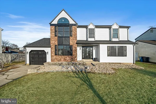 a front view of a house with yard