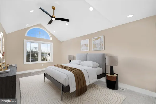 a bedroom with a large bed and a window