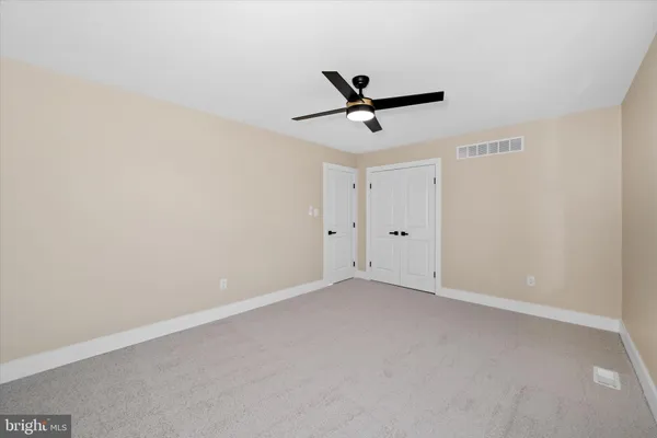 a view of a big room with carpet