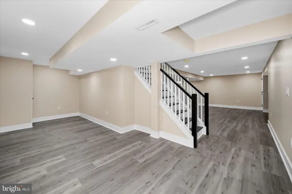 a view of an entryway with wooden floor