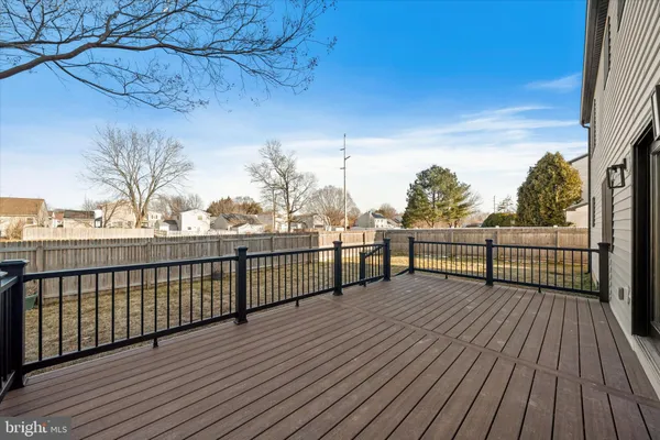 a view of a balcony with wooden floor