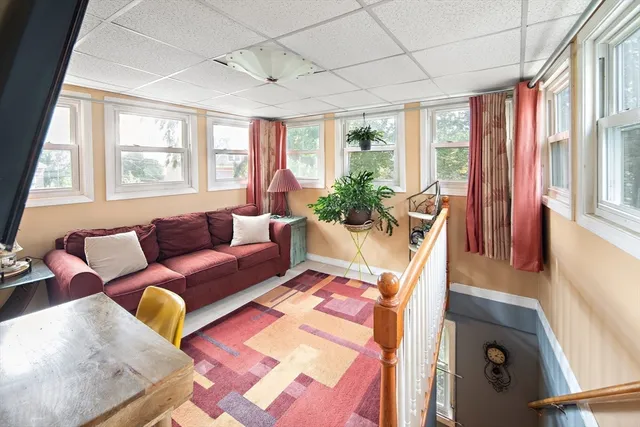 a bedroom with a large bed and a dresser