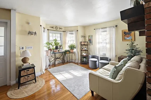 a view of a room with lots of wooden furniture