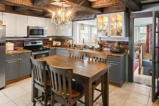 a kitchen with lots of counter top space and appliances